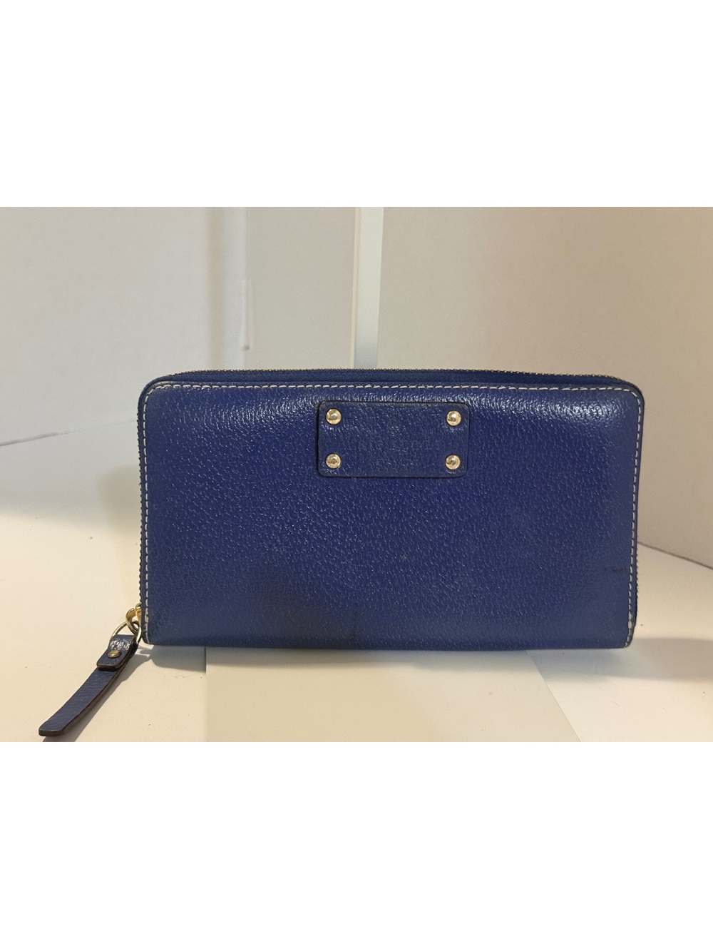 Kate Spade New York blue zip-around wallet with Polka dot interior